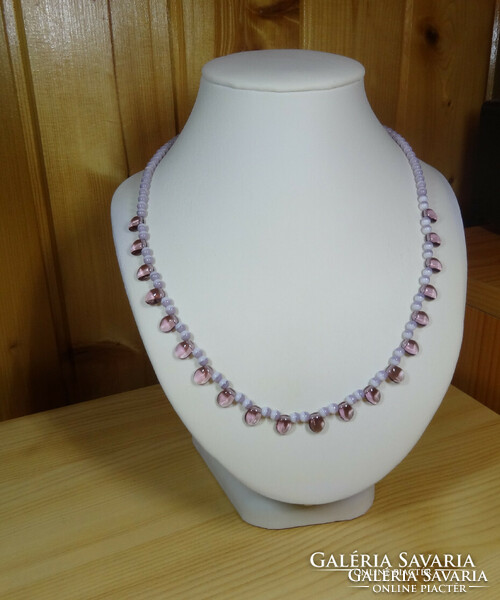 Amethyst-colored quality glass necklace, closes with a fish clasp.