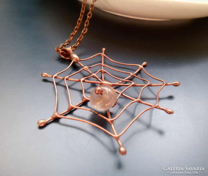 Handmade pendant in the shape of a spider's web