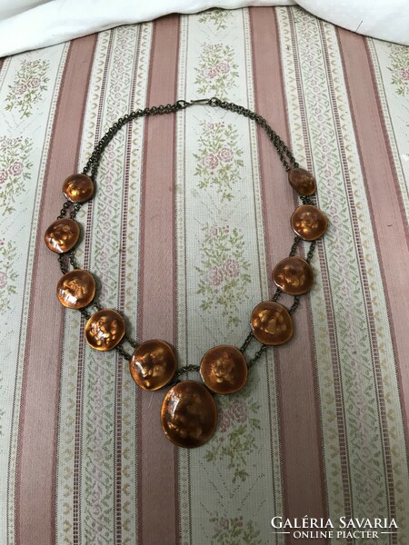 A golden brown fire enamel necklace on a copper chain made by an artisan