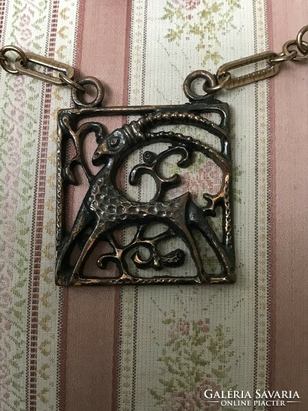 Applied art bronzed metal horoscope Aries or Capricorn pendant on a chain