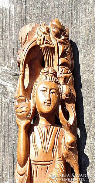 Eastern fertility goddess wooden statue