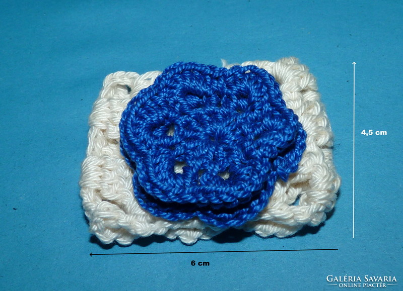 Crocheted napkin ring with blue flowers