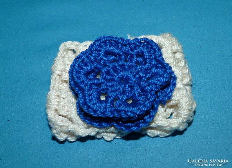 Crocheted napkin ring with blue flowers
