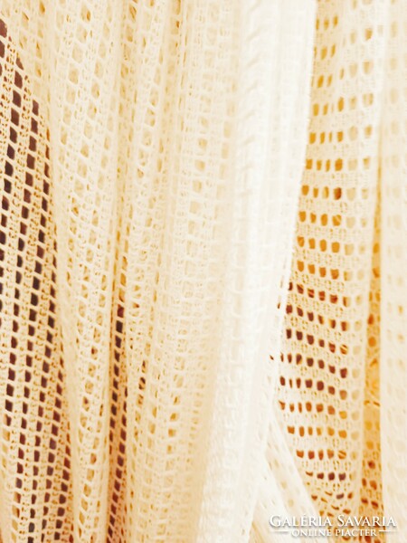 A pair of white thread curtains
