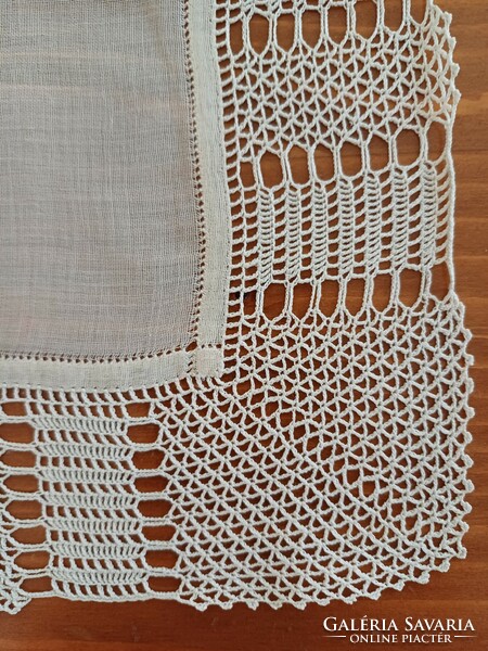 Showcase tablecloth decorated with crochet