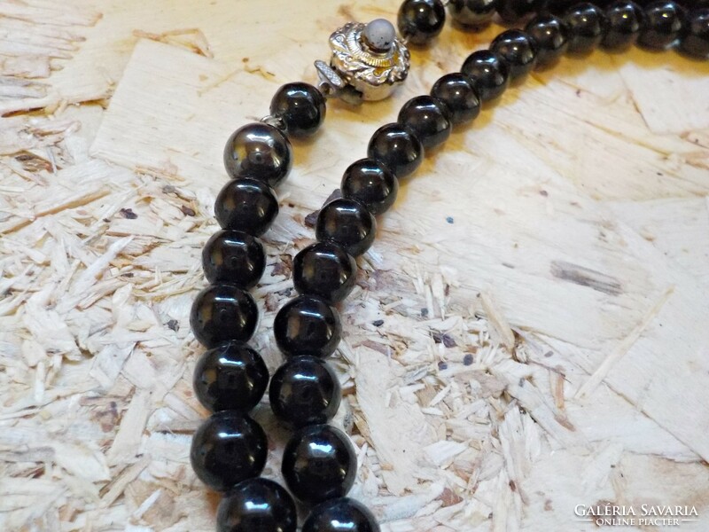 Old black glass necklace with decorative clasp