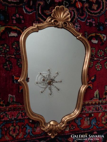 Beautifully shaped gilded - carved mirror