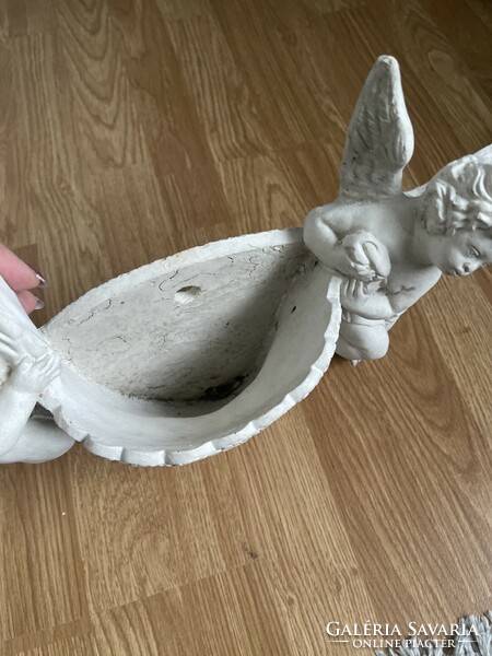 Large, heavy planter putts will be held in place by cast stone.