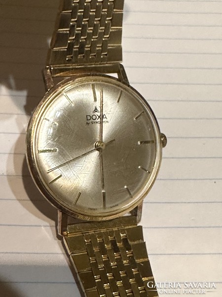 14 Kr gold doxa with beautiful strap and perfect cover for sale! Price: 150,000.-