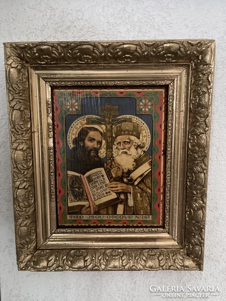Large holy image on a wooden sheet in a wooden frame.