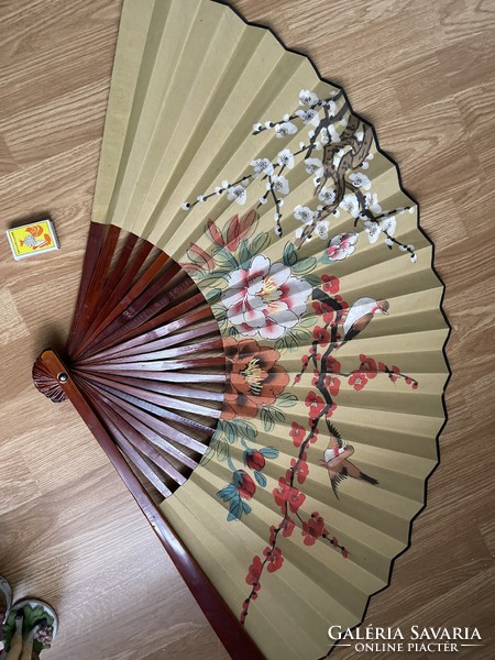 Beautiful wooden fan hand-painted on old large canvas.
