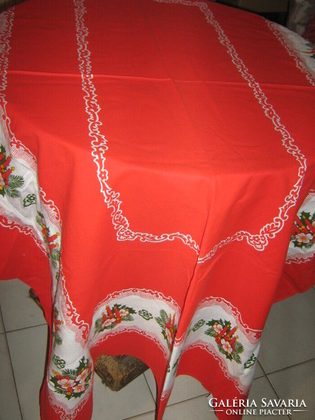 Beautiful red Christmas tablecloth with candles