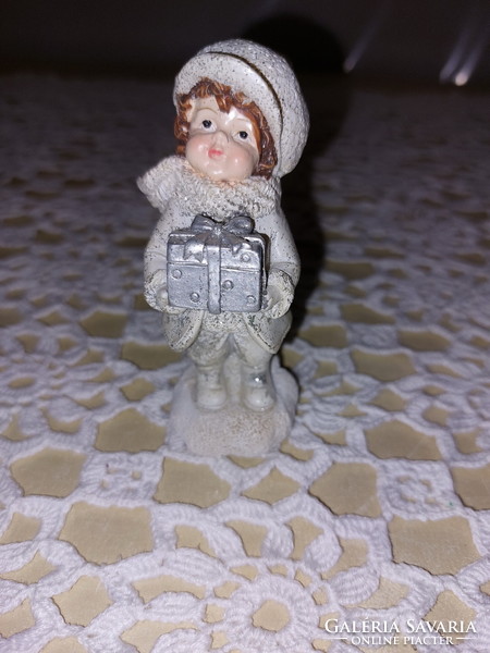 Little girl figure with a gift, winter, Christmas