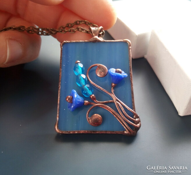 Special handcrafted glass jewelry pendant made of blue glass and pearls