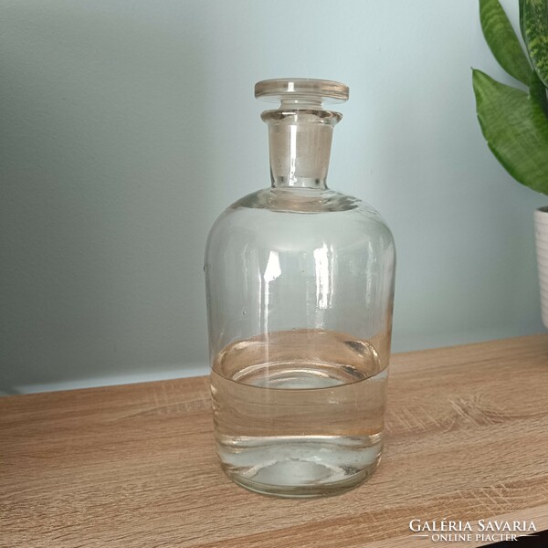 Antique apothecary bottle with wide neck and matching polished glass stopper