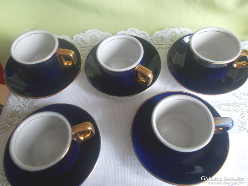 Retro coffee cups with gilded edges and saucers