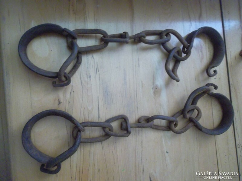 Antique wrought iron horse shackles in a pair