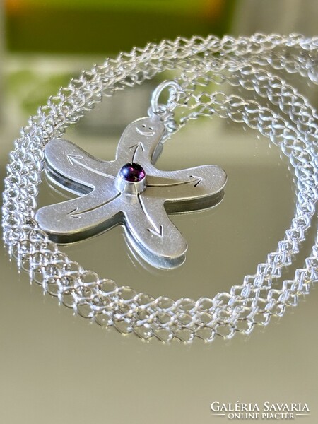 A wonderful, cheerful silver necklace with a garnet stone