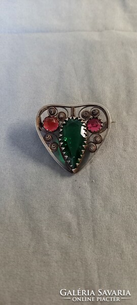 Antique silver brooch with green and red stones