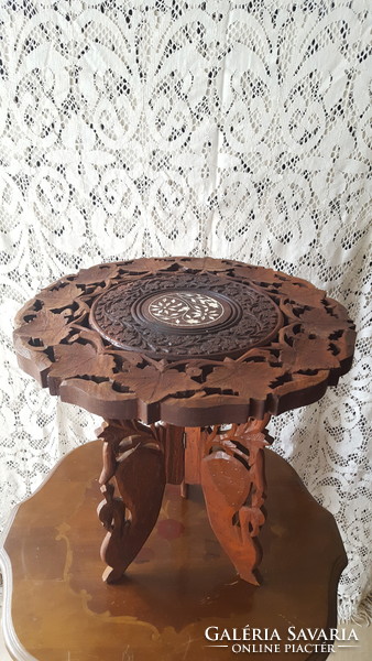Carved openwork rosewood table with inlay