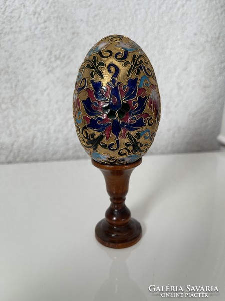 Beautiful collectible large compartment with Chinese egg in wooden holder.