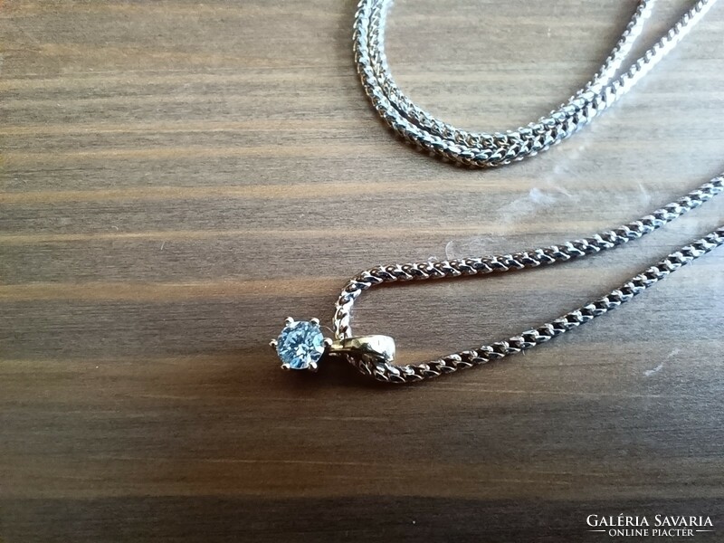 Gold necklace with small diamond pendant