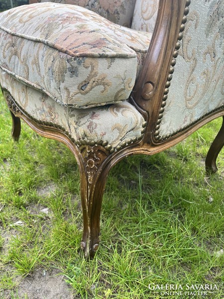 Antique armchair with floral pattern cover