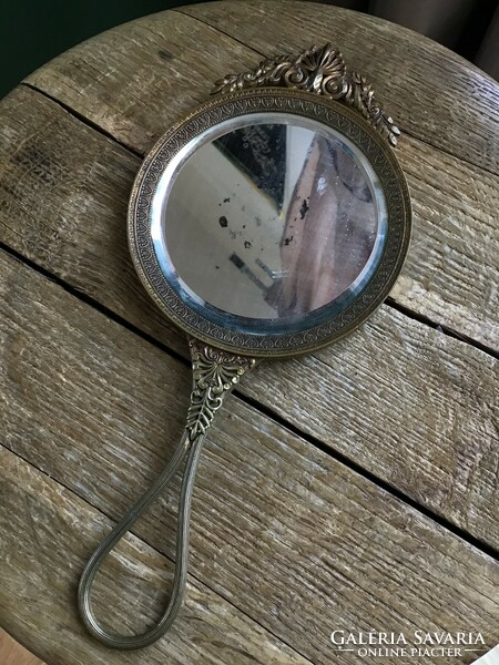 Antique French copper hand mirror with polished glass.