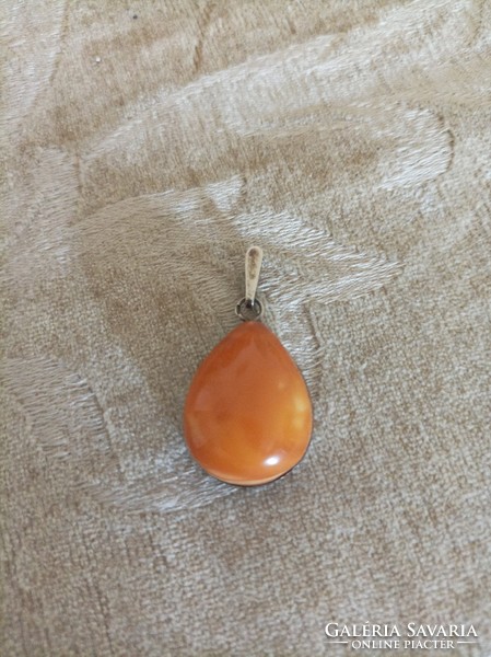 Mineral pendant in a silver frame /sunstone or jade/