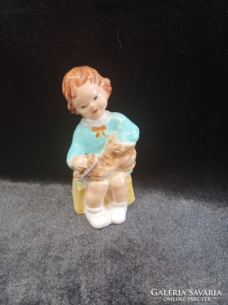 Ceramic little girl cleaning shoes
