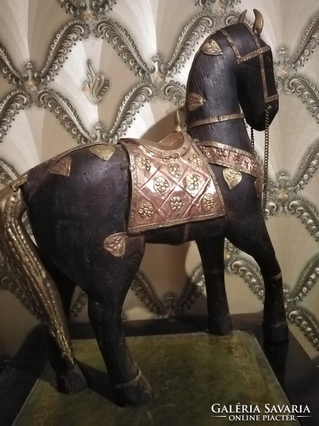 Antique wooden horse with copper decoration