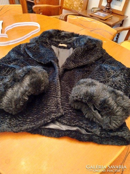Black, short, synthetic fur, used.