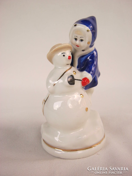 Child building a snowman retro Soviet porcelain