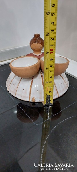 Ceramic figurine of a girl with a bowl