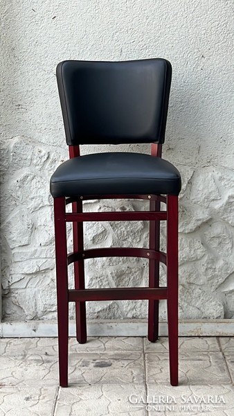 Antique style bar stool with faux leather upholstery