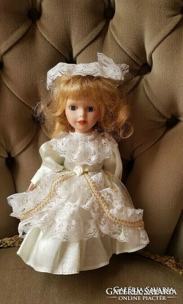 A charming blonde doll with a porcelain head