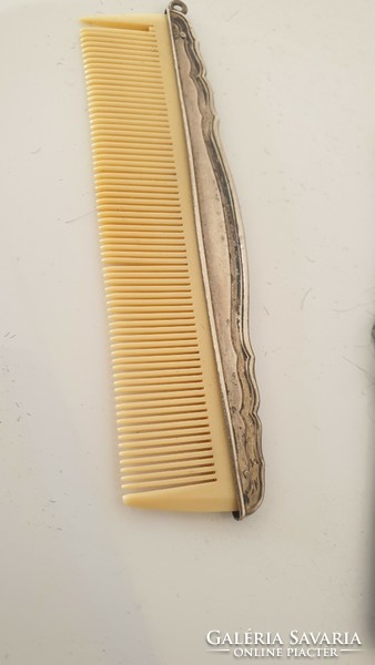 Comes with antique silver comb case