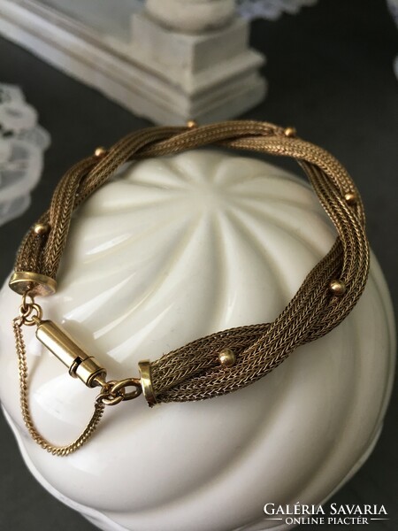 Special, braided, antique bracelet decorated with small gold pearls