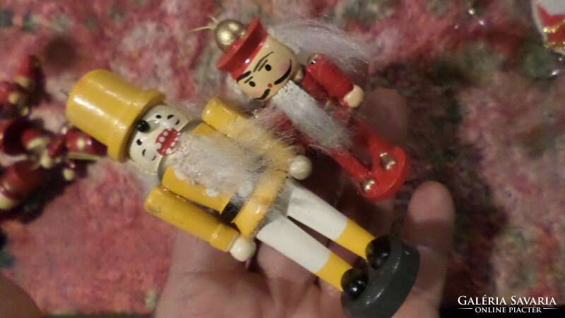2 wooden Christmas tree ornaments, (nutcracker figure), together.
