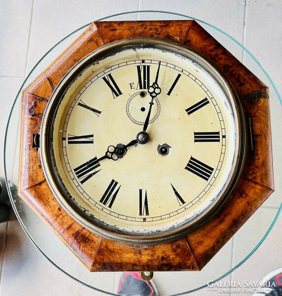Antique half-baked wall clock, ship's clock