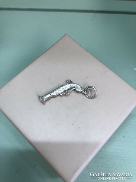 Small silver rifle pendant