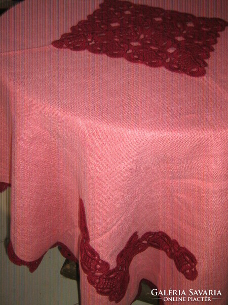 Beautiful mauve-burgundy woven tablecloth with a hand-crocheted edge and decorated with crochet