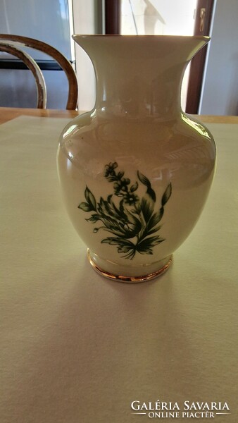 Raven's house vase with green flowers