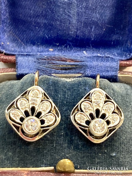 Women's earrings with a pair of diamonds.
