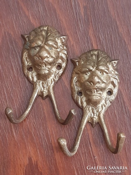 Pair of antique lion copper hangers