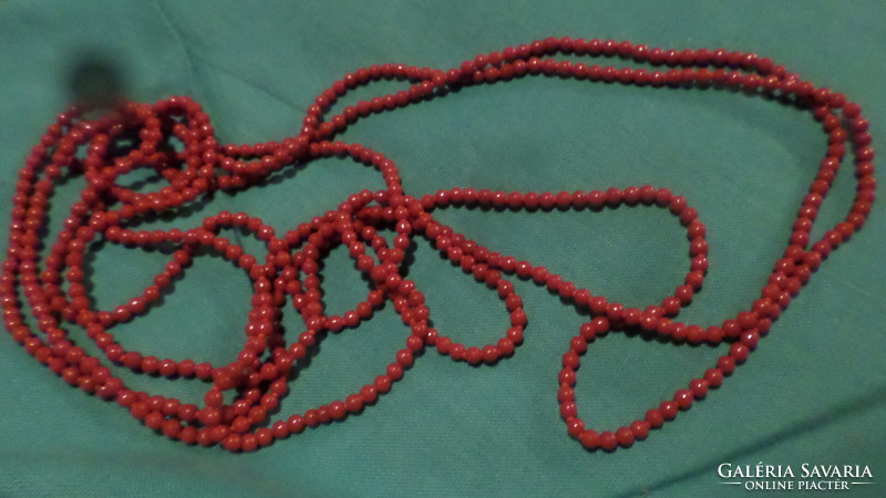 Extremely long 280 cm necklace without clasp made of shiny red glass beads.