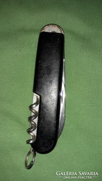 Old steel / black vinyl handle multi-function Swiss army knife + holder as shown in the pictures