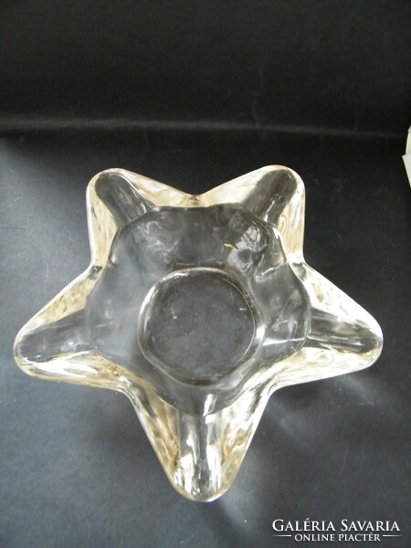 A large, star-shaped glass ashtray