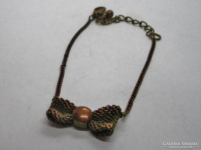 Szép kis finom masnis  réz karkötő