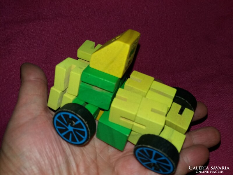 Érdekes fából készült TRANSFORMERS figura rengeteg variációs lehetőség, szép állapot a képek szerint